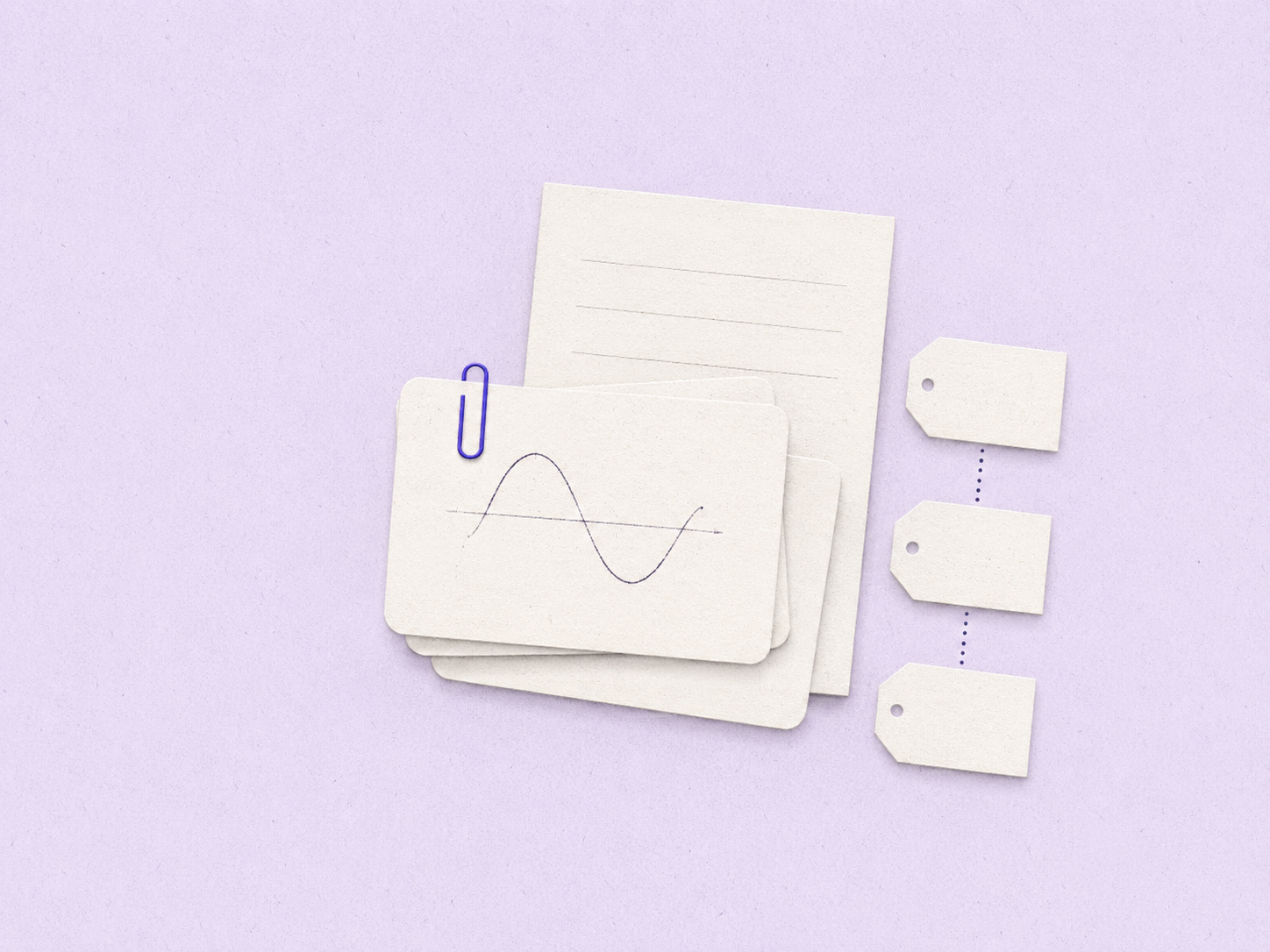 A small stack of flashcards and a teacher’s deck on a calm lavender desk, held by a single indigo paper clip